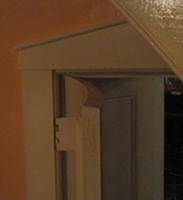closer look at curvature of curve door replicated by Welch Millwork and Design