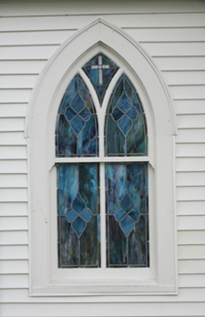 close-up on one of the stained glass windows set by Welch Millwork and Design